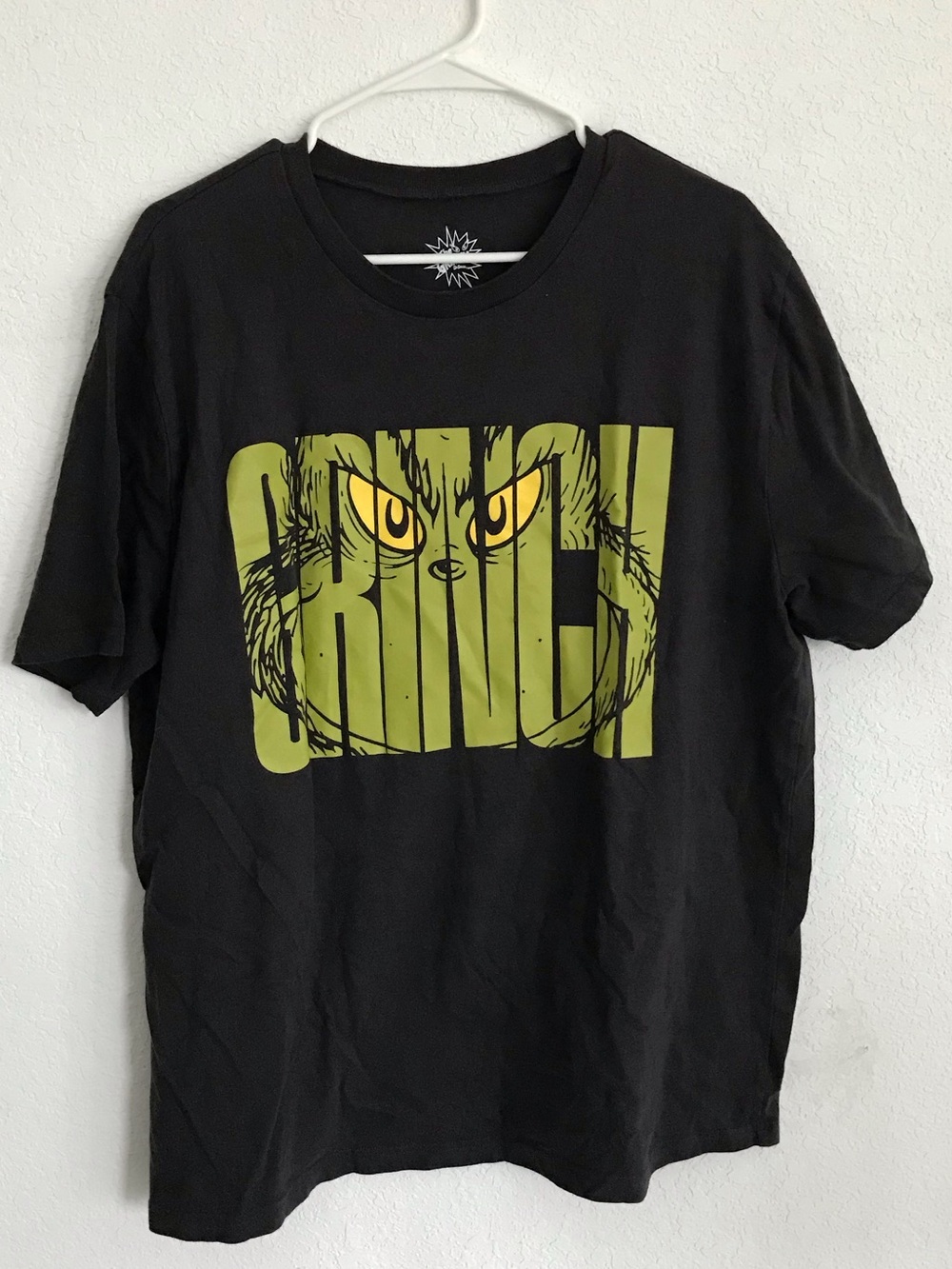 MAD Engine Black Tee with Green Grinch Graphic and Yellow Eyes